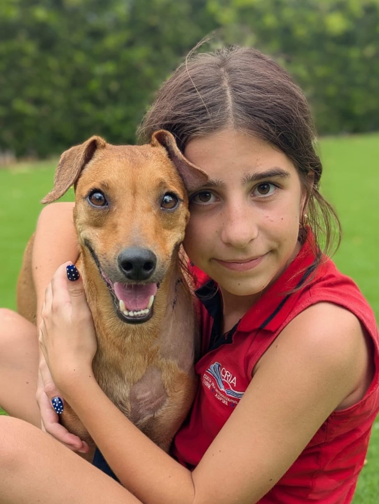A girl hugging a rescue dog